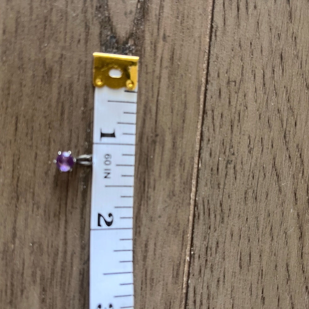 Amethyst in silver pendant. No chain.